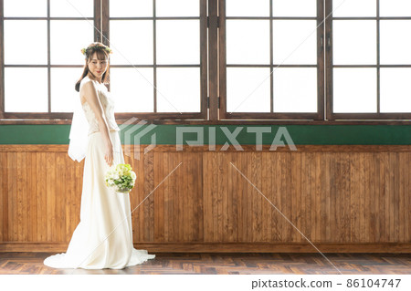 A bridal image of a woman wearing a wedding 86104747