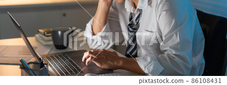Overwork Concept The male officer resting his face on his right hand and making a stressful face Overwork Concept The male officer resting his face on his right hand and making a stressful face 86108431