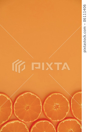 Tangerine slice and copy space vertical composition Tangerine slice and copy space vertical composition 86111406