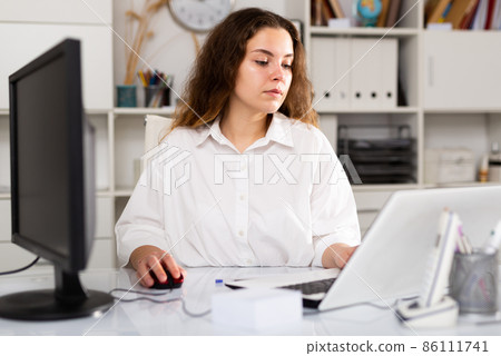 Portrait of young female office worker 86111741