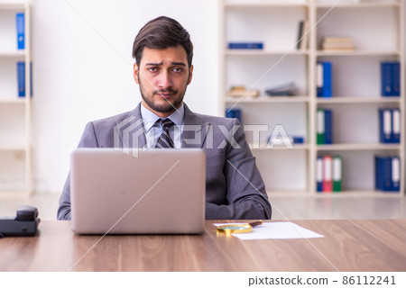 Young handsome businessman employee working in the office Young handsome businessman employee working in the office 86112241