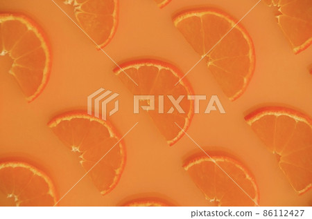 Half slices of mandarin oranges lined up on one side Half slices of mandarin oranges lined up on one side 86112427