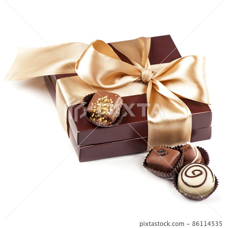 brown box with candies and golden tape 86114535