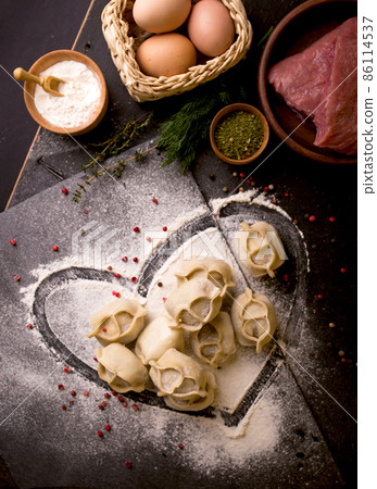 traditional Eastern dish manti or manty with beef in a dark 86114537