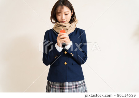 A high school girl praying for success with a talisman 86114559