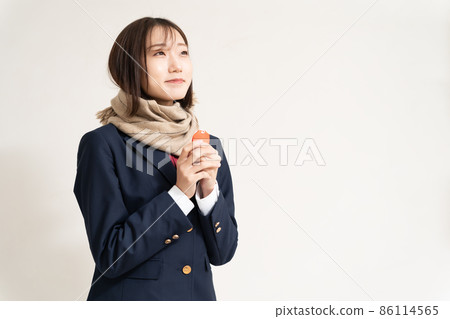A high school girl praying for success with a talisman A high school girl praying for success with a talisman 86114565