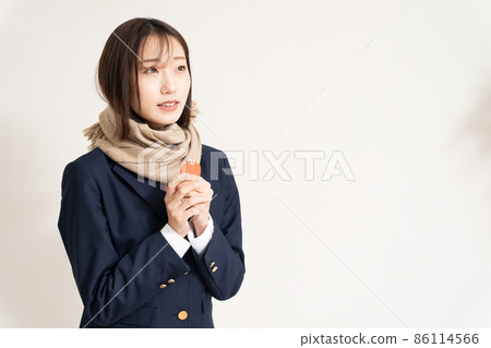 A high school girl praying for success with a talisman A high school girl praying for success with a talisman 86114566
