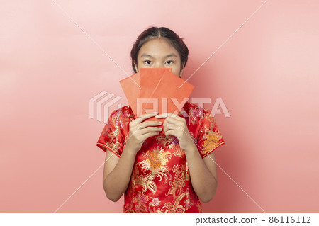 Portrait of Asian girl wearing a red dress Chinese, Chinese New Year Concept 86116112
