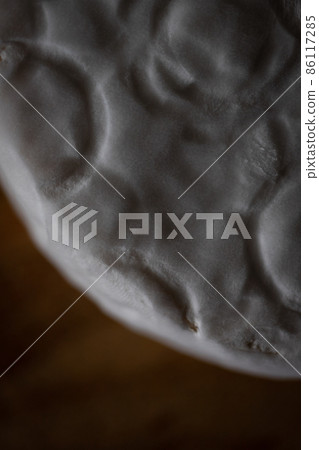 Homemade cheese with white mold. Macro photo. Top view. Homemade cheese with white mold. Macro photo. Top view. 86117285
