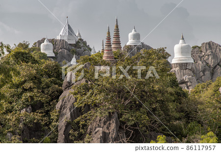 Pagoda on top of the cliff high mountain at Chaloem Phrakiat Phrachomklao Rachanuson temple (Wat Phrabat Pu Pha Daeng). 86117957