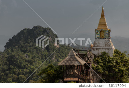 Pagoda on top of the cliff high mountain at Chaloem Phrakiat Phrachomklao Rachanuson temple (Wat Phrabat Pu Pha Daeng). 86117994