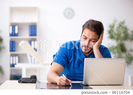 Young male doctor radiologist working in the clinic 86118704