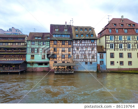 View of medieval buildings reflection on the channel at little france quarter in Strasbourg at winter 86119764