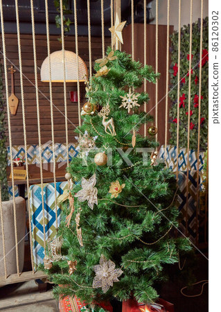 Fir branch with balls and festive lights on the Christmas background. 86120302
