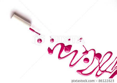 Blot of pink nail polish and brush isolated on white background with copy space for text. Manicure, pedicure, cosmetics concept. 86122823