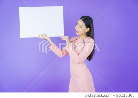Portrait beautiful young asian woman with empty white billboard Portrait beautiful young asian woman with empty white billboard 86123303