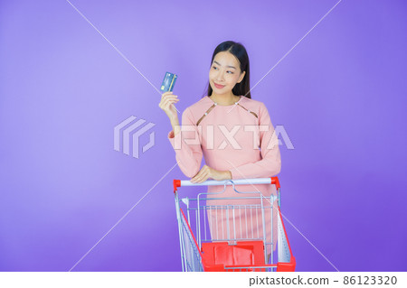 Portrait beautiful young asian woman smile with grocery basket Portrait beautiful young asian woman smile with grocery basket 86123320
