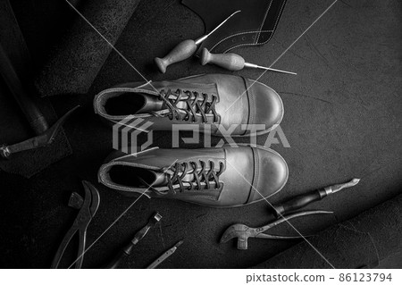 Handcrafted brown leather shoes with cobbler tools 86123794