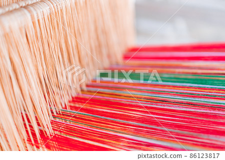 Thai and Asian Style Vintage textile thread machine to make traditional clothing and fabric pattern weaving. 86123817