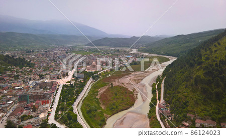 Panoramic aerial view to Berat old town and Osum river from Berat Castle , Albania Panoramic aerial view to Berat old town and Osum river from Berat Castle , Albania 86124023