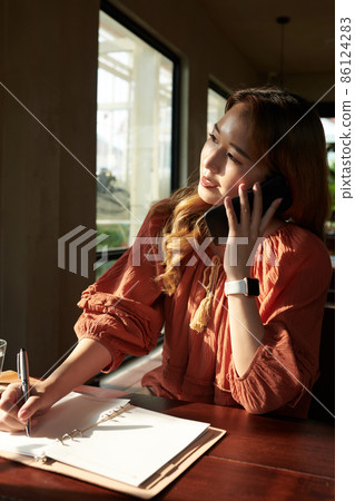 Businesswoman Talking on Phone 86124283