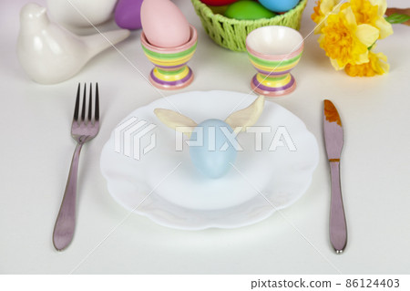 Easter table setting and dinner festive decorations Easter table setting and dinner festive decorations 86124403