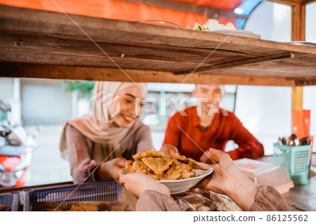 muslim couple ordering food to break fasting in ramadan 86125562