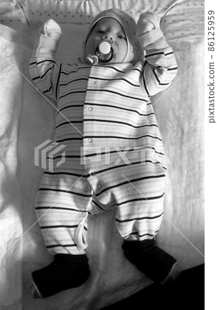 Beautiful baby boy with child face posing photographer Beautiful baby boy with child face posing photographer 86125959