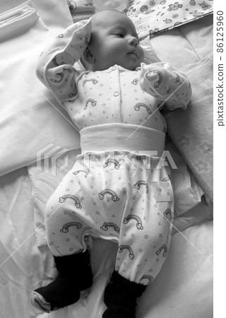 Sleeping baby boy with child clothes posing photographer Sleeping baby boy with child clothes posing photographer 86125960