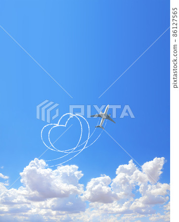 Vertical nature background with aircraft draw a heart in the sky. Flight route of aircraft in shape of a heart 86127565