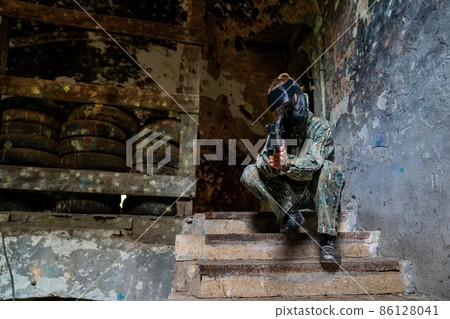 soldier training while playing paintball in the fortress 86128041