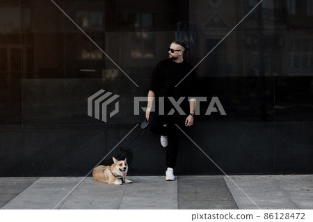 man poses with a dog man poses with a dog 86128472