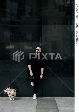 male model with corgi dog male model with corgi dog 86128473