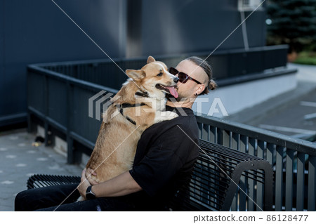 man hugging pretty dog man hugging pretty dog 86128477