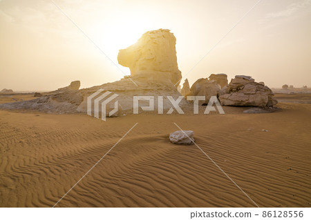 Chalk rocks in the White Desert at sunset. Egypt, Baharia Chalk rocks in the White Desert at sunset. Egypt, Baharia 86128556