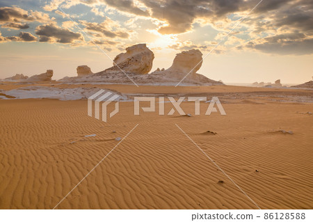 Chalk rocks in the White Desert at sunset. Egypt, Baharia Chalk rocks in the White Desert at sunset. Egypt, Baharia 86128588