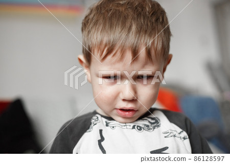 Little Caucasian boy looking at camera, lifestyle photography Little Caucasian boy looking at camera, lifestyle photography 86128597