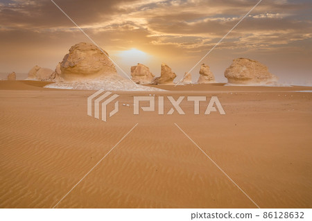 Chalk rocks in the White Desert at sunset. Egypt, Baharia Chalk rocks in the White Desert at sunset. Egypt, Baharia 86128632