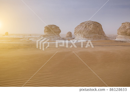 Chalk rocks in the White Desert at sunset. Egypt, Baharia Chalk rocks in the White Desert at sunset. Egypt, Baharia 86128633