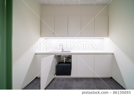 At the bottom of the cupboard of a modern kitchen At the bottom of the cupboard of a modern kitchen 86130893
