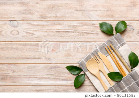 Eco friendly reusable recyclable white eco bag with kitchenware on Colored background. Concept zero waste Eco friendly reusable recyclable white eco bag with kitchenware on Colored background. Concept zero waste 86131582
