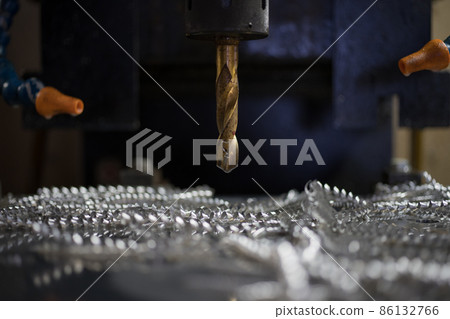 Drilling holes in aluminum plates at a machining center Drilling holes in aluminum plates at a machining center 86132766