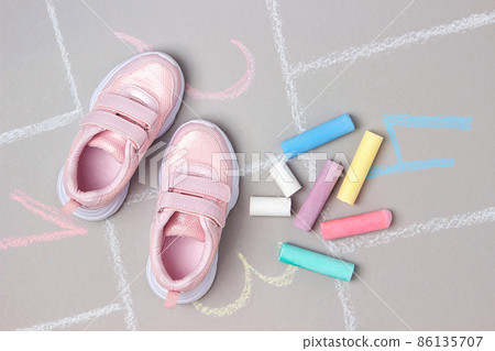 Pink sneakers and hopscotch game. Top view Flat lay 86135707