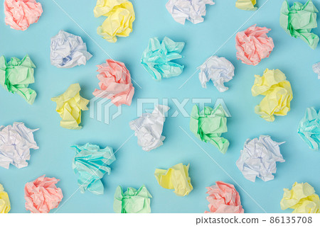 Pattern made with colored crumpled paper balls on blue background, texture. Top view Flat lay 86135708