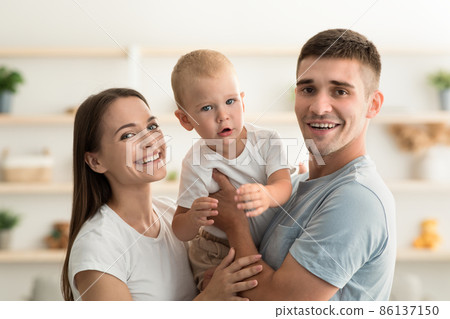 Millennial Family. Portrait Of Happy Young Mother And Father With Infant Child 86137150