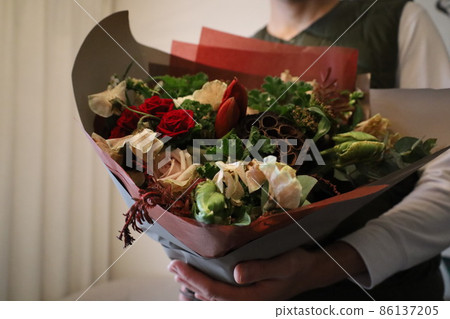 Fashionable interior terrier to decorate a vase with a purple bouquet A fashionable interior terrier to decorate a vase with a purple bouquet 86137205