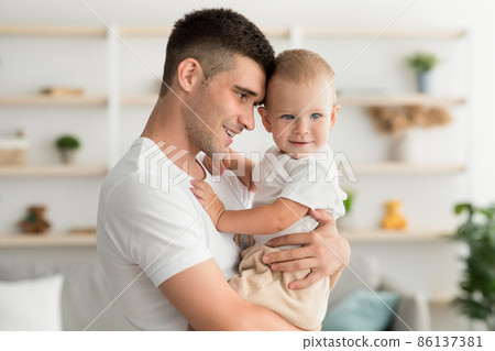 Father's Love. Happy Millennial Daddy Bonding With Cute Infant Son At Home 86137381