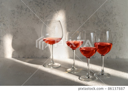 Many glasses of red wine at a wine tasting. Many glasses of red wine at a wine tasting. 86137887