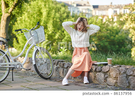 Young cute girl looking sleepy and relaxed Young cute girl looking sleepy and relaxed 86137956