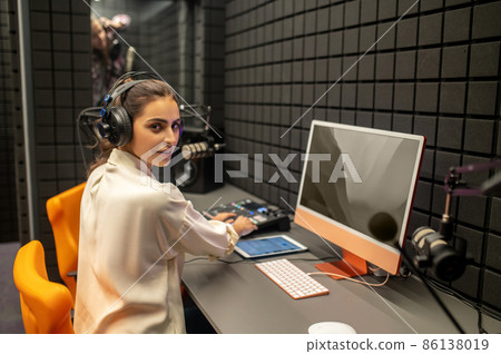 Professional working on the mixing console in the studio Professional working on the mixing console in the studio 86138019
